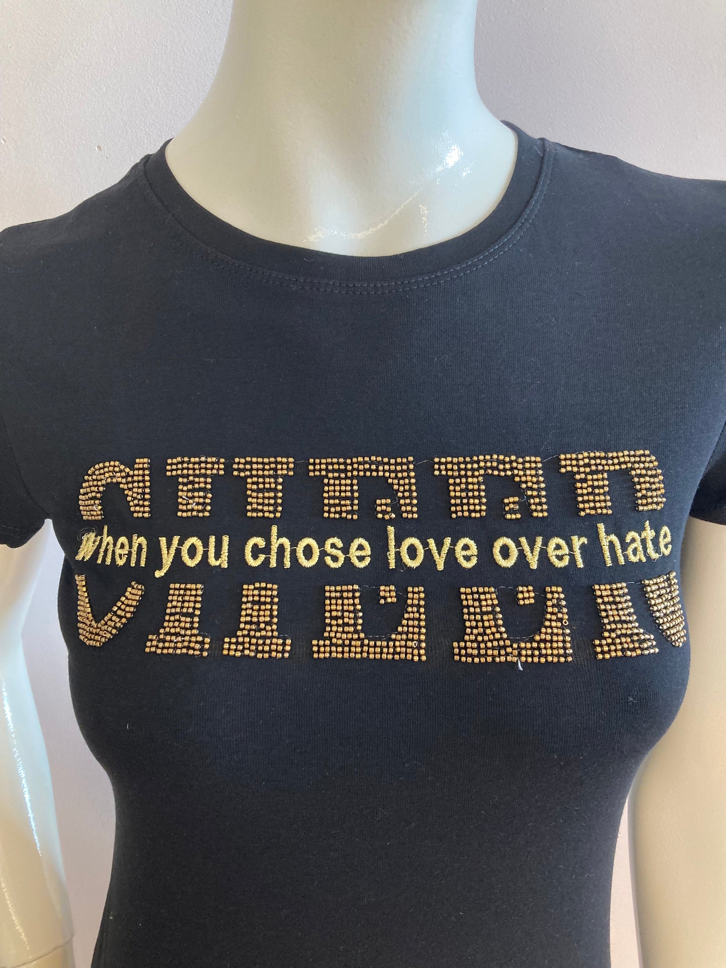 Black t-shirt with golden writing