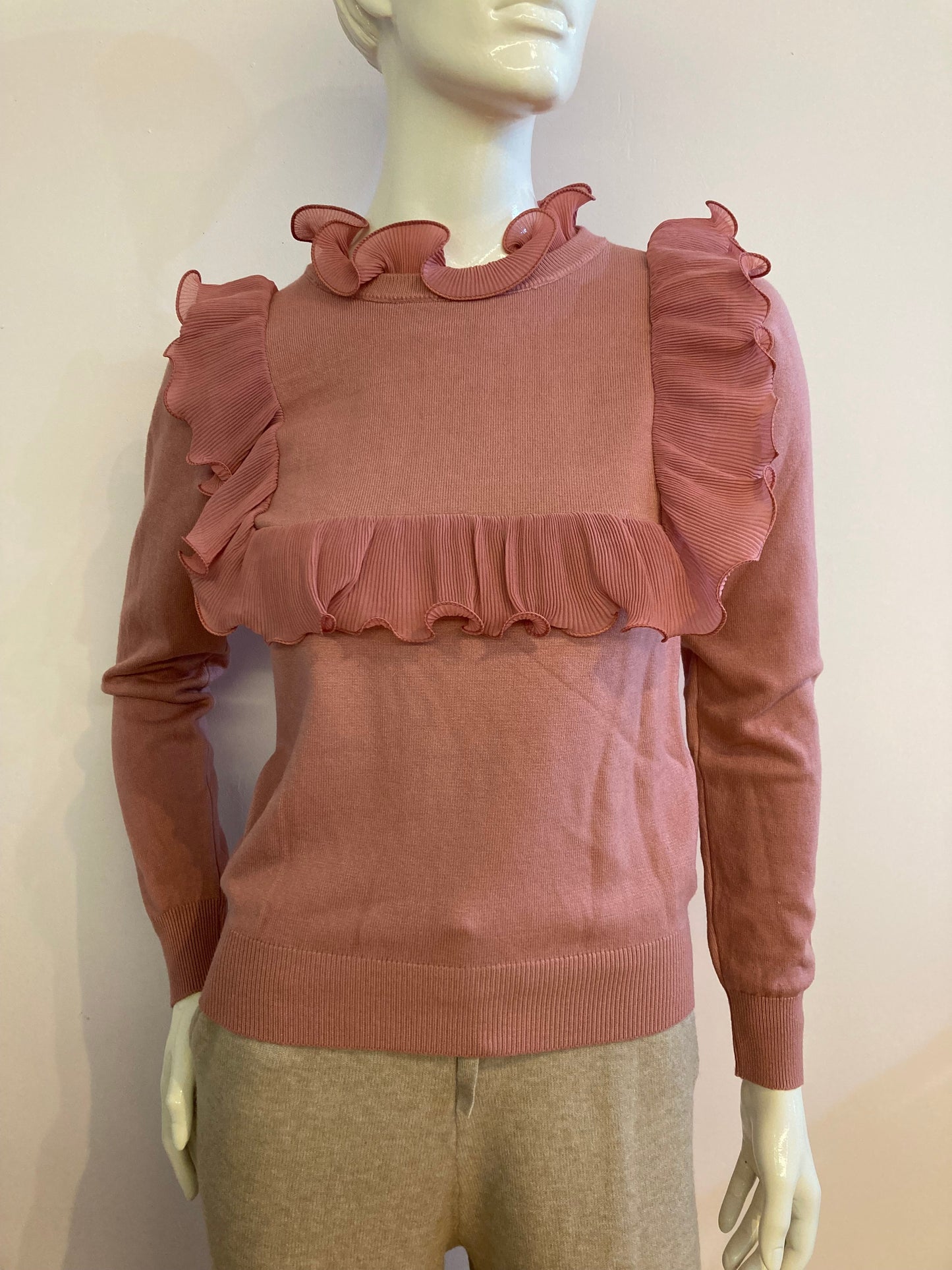 Pink sweater with frill on the front and back