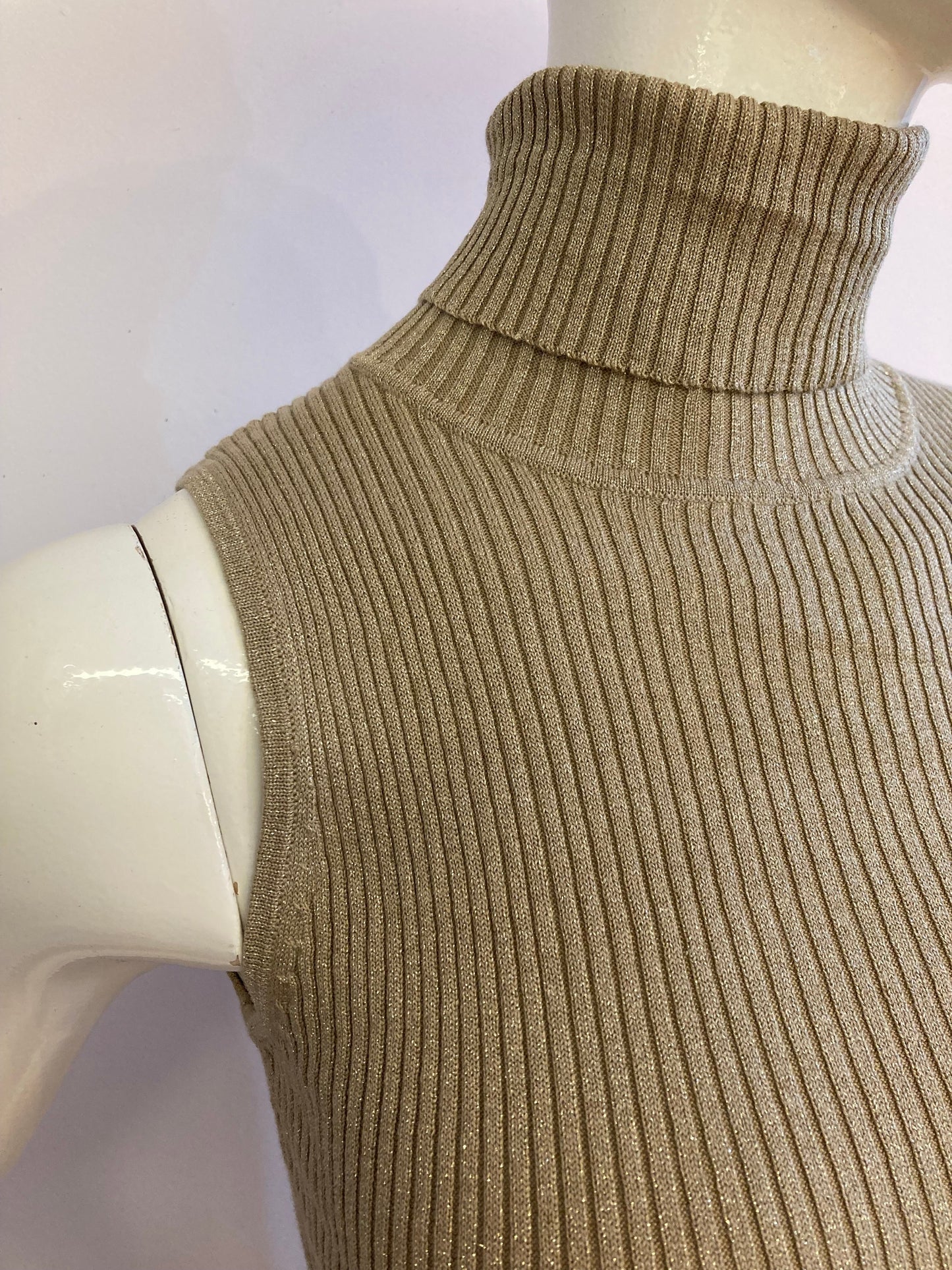 Beige turtleneck cropped sleeveless sweater