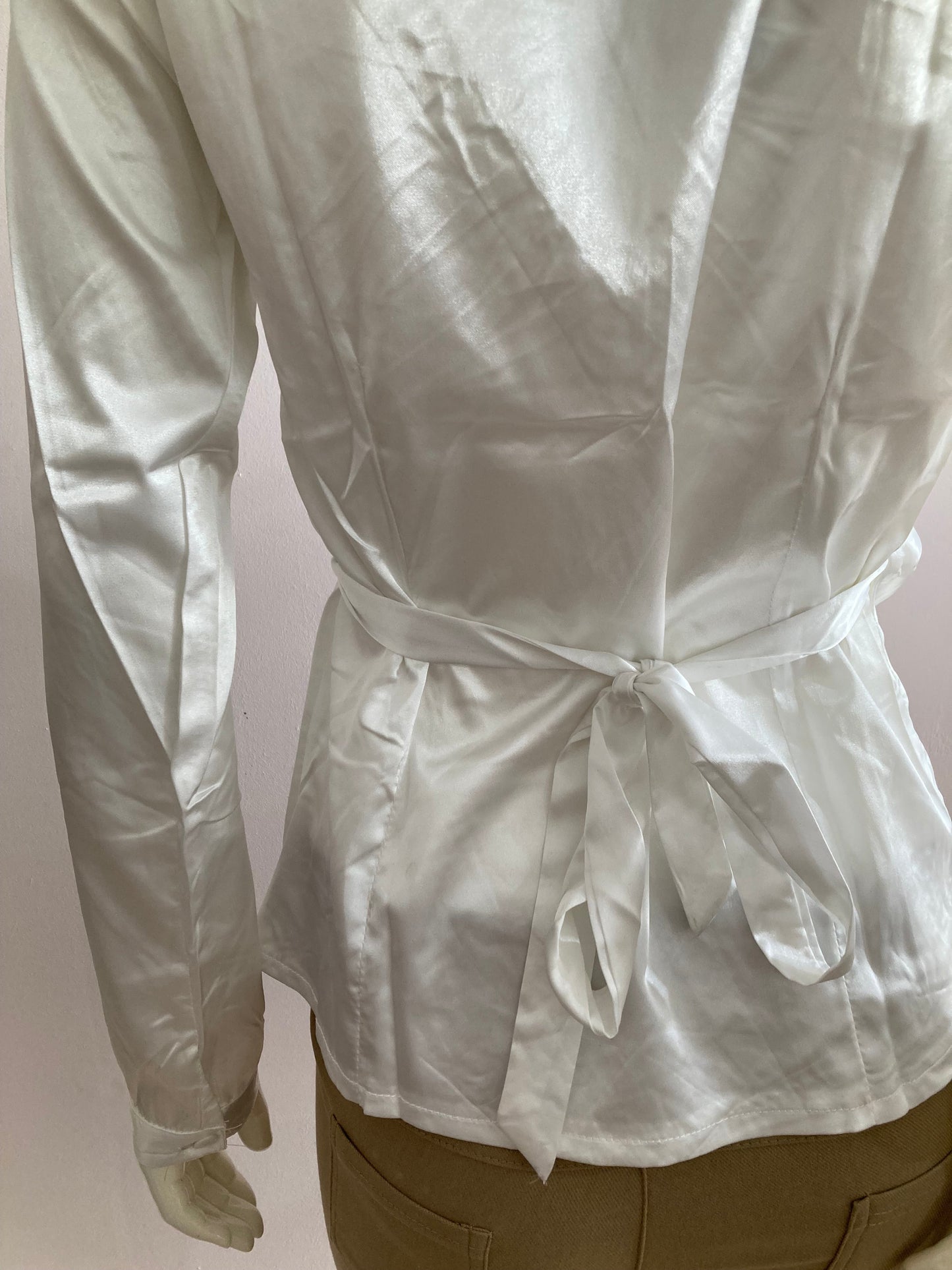 White satin wrap-style blouse