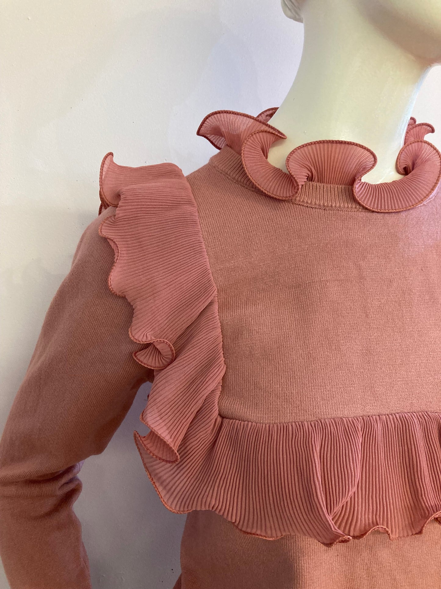 Pink sweater with frill on the front and back