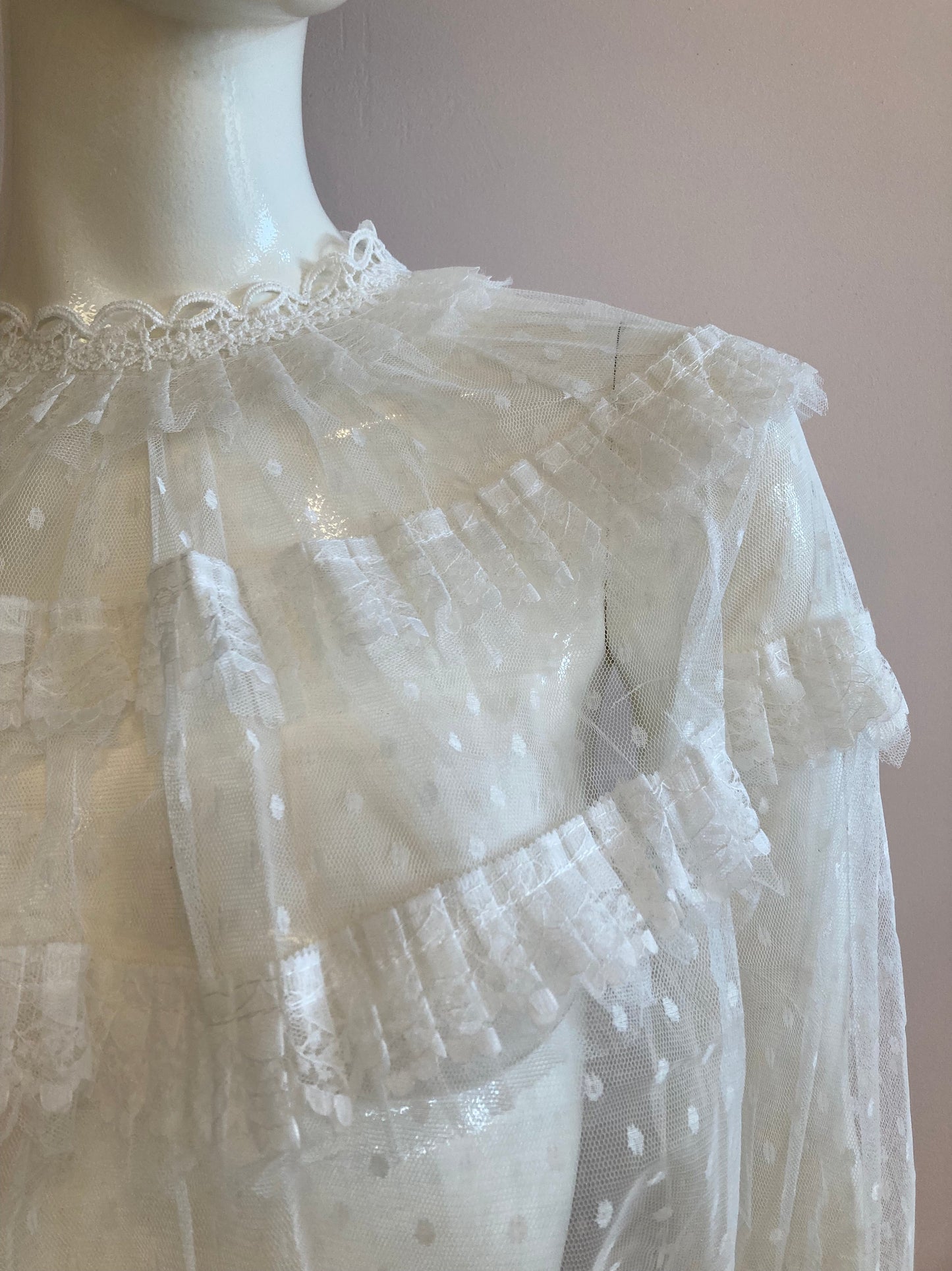 White blouse with plumetis tulle and ruffled