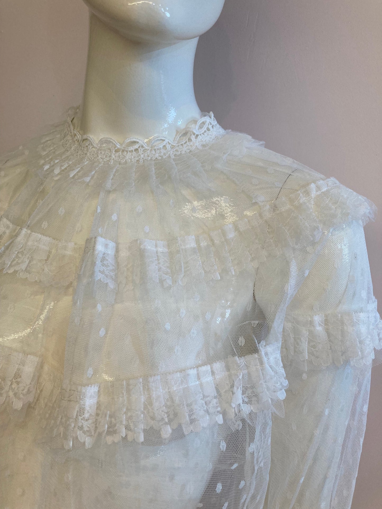 White blouse with plumetis tulle and ruffled