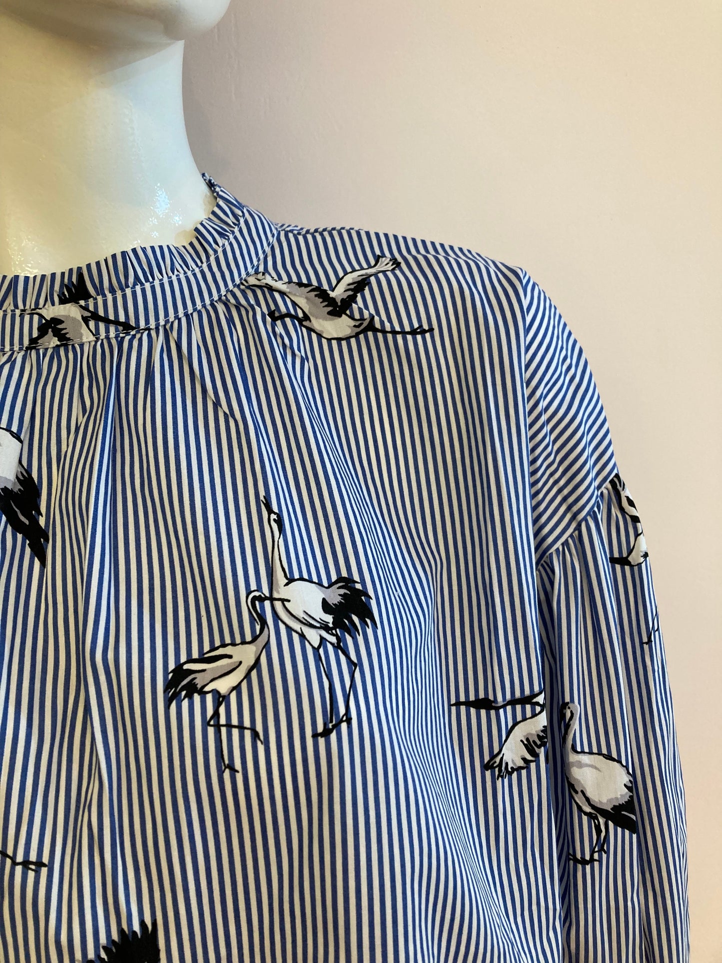 Blue striped blouse with bird motif