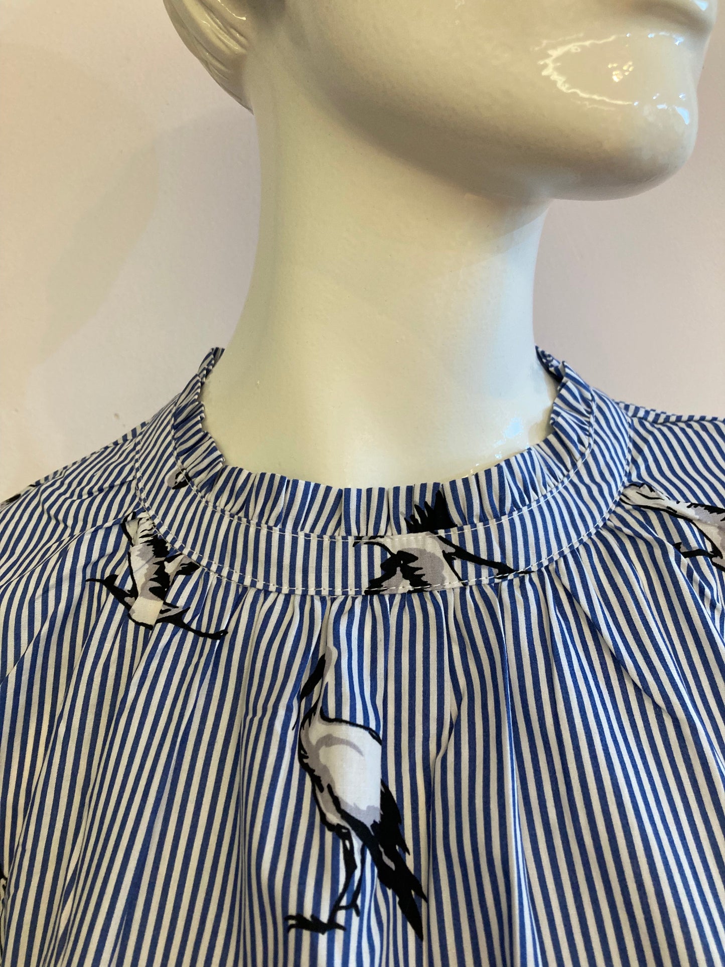 Blue striped blouse with bird motif