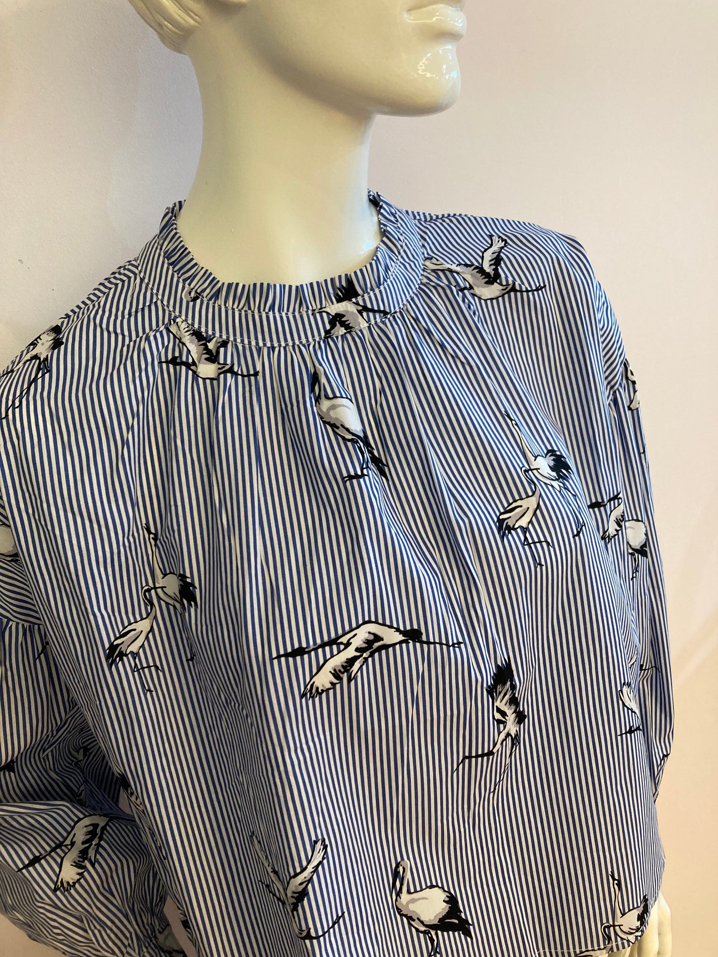 Blue striped blouse with bird motif