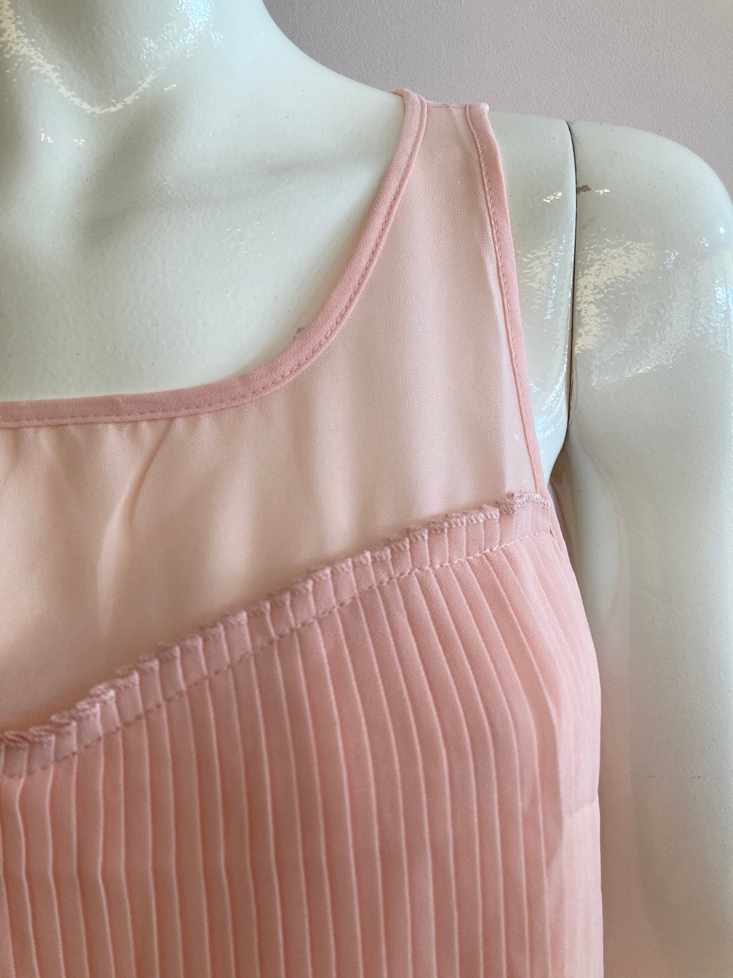 Pink blouse lined and pleated at the front