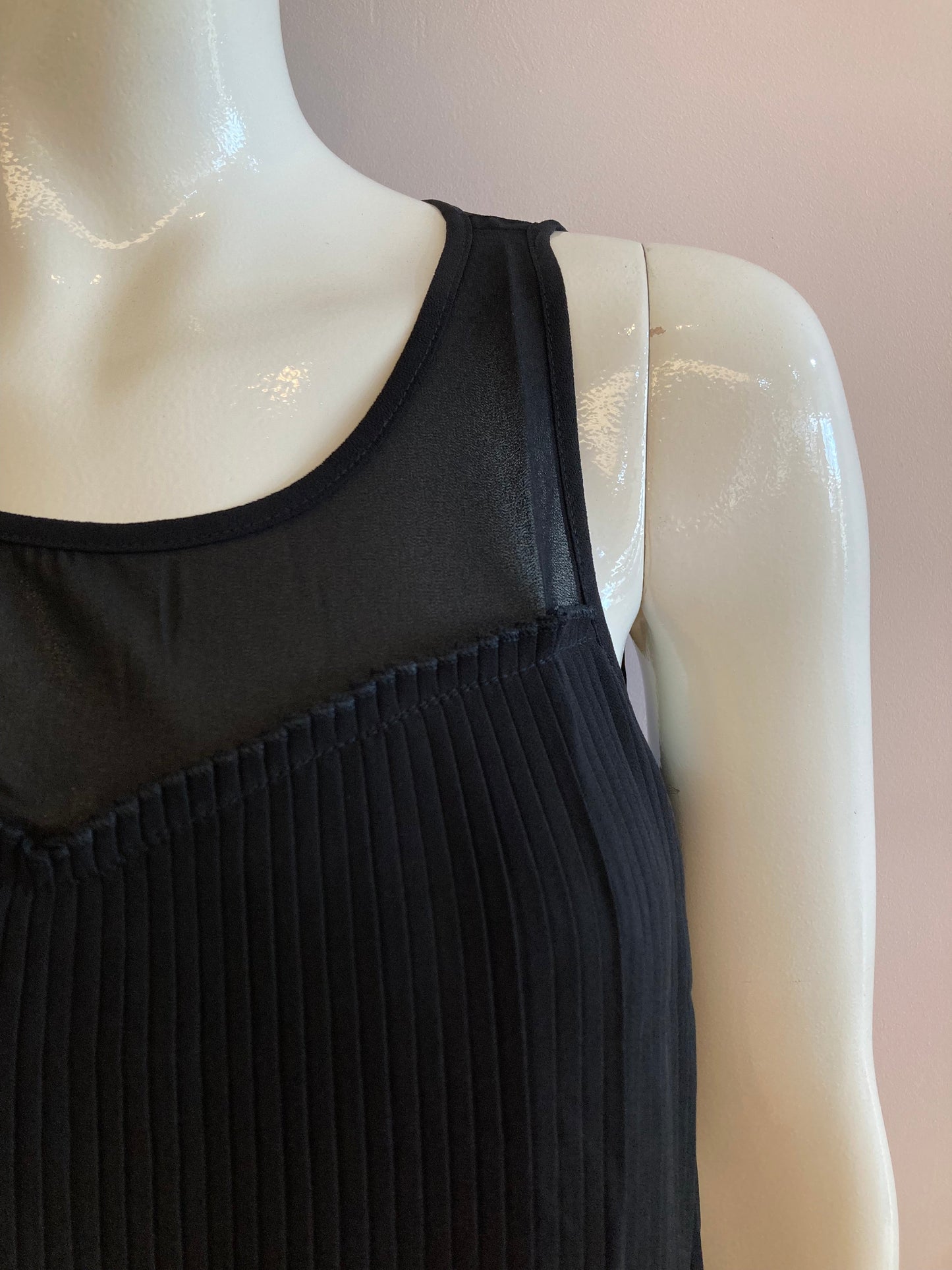 Black blouse lined and pleated at the front