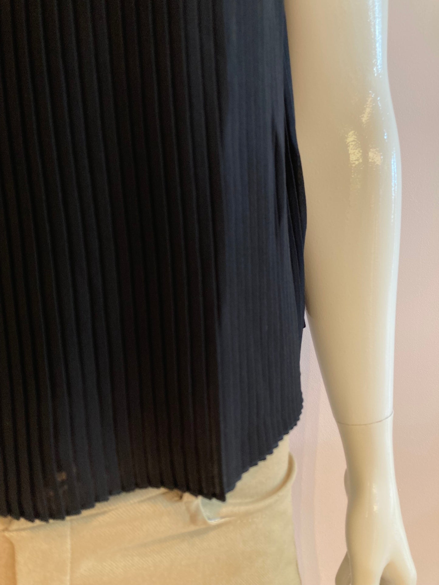 Black blouse lined and pleated at the front