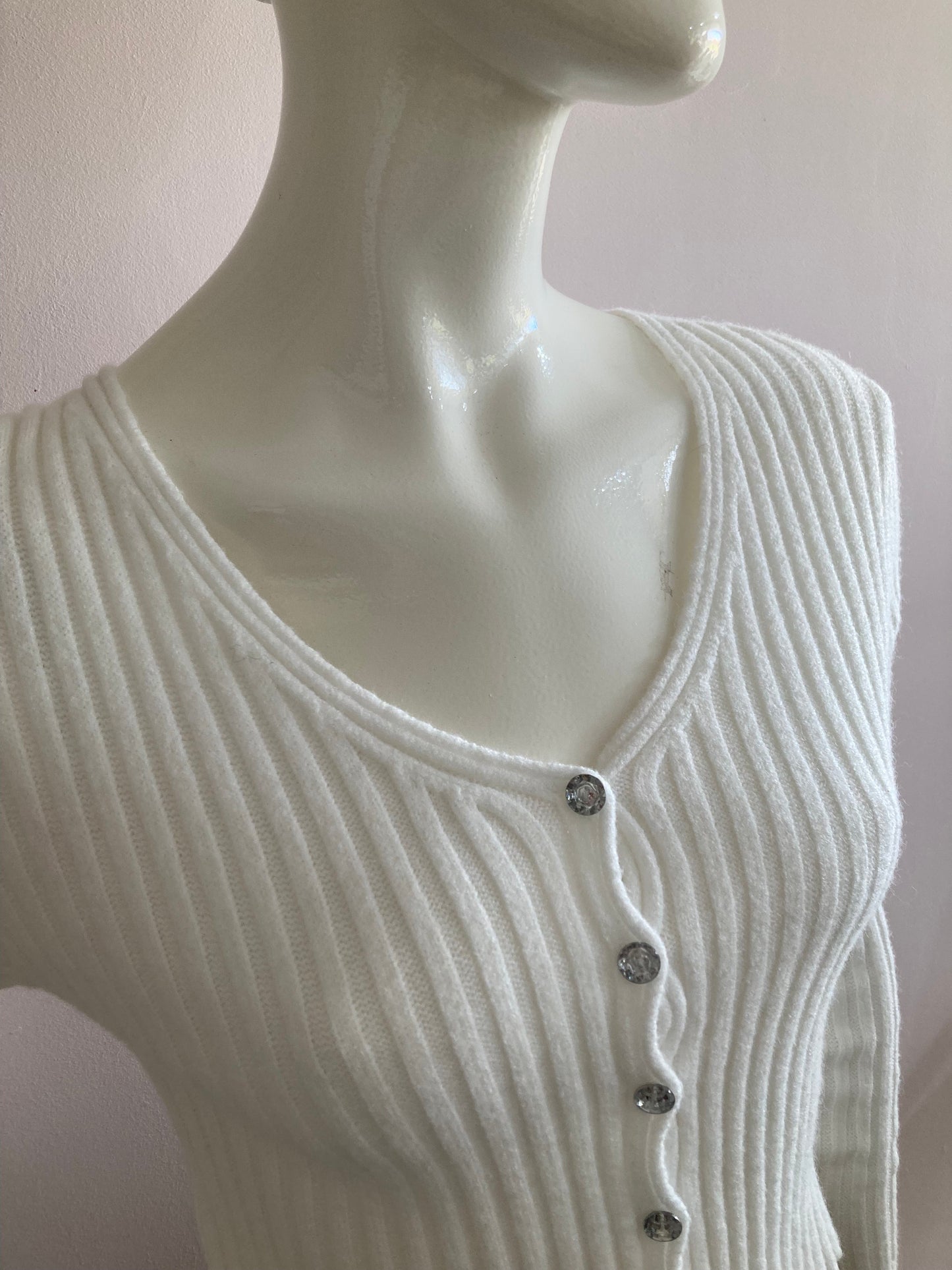 Nice short ribbed white cardigan with shiny buttons