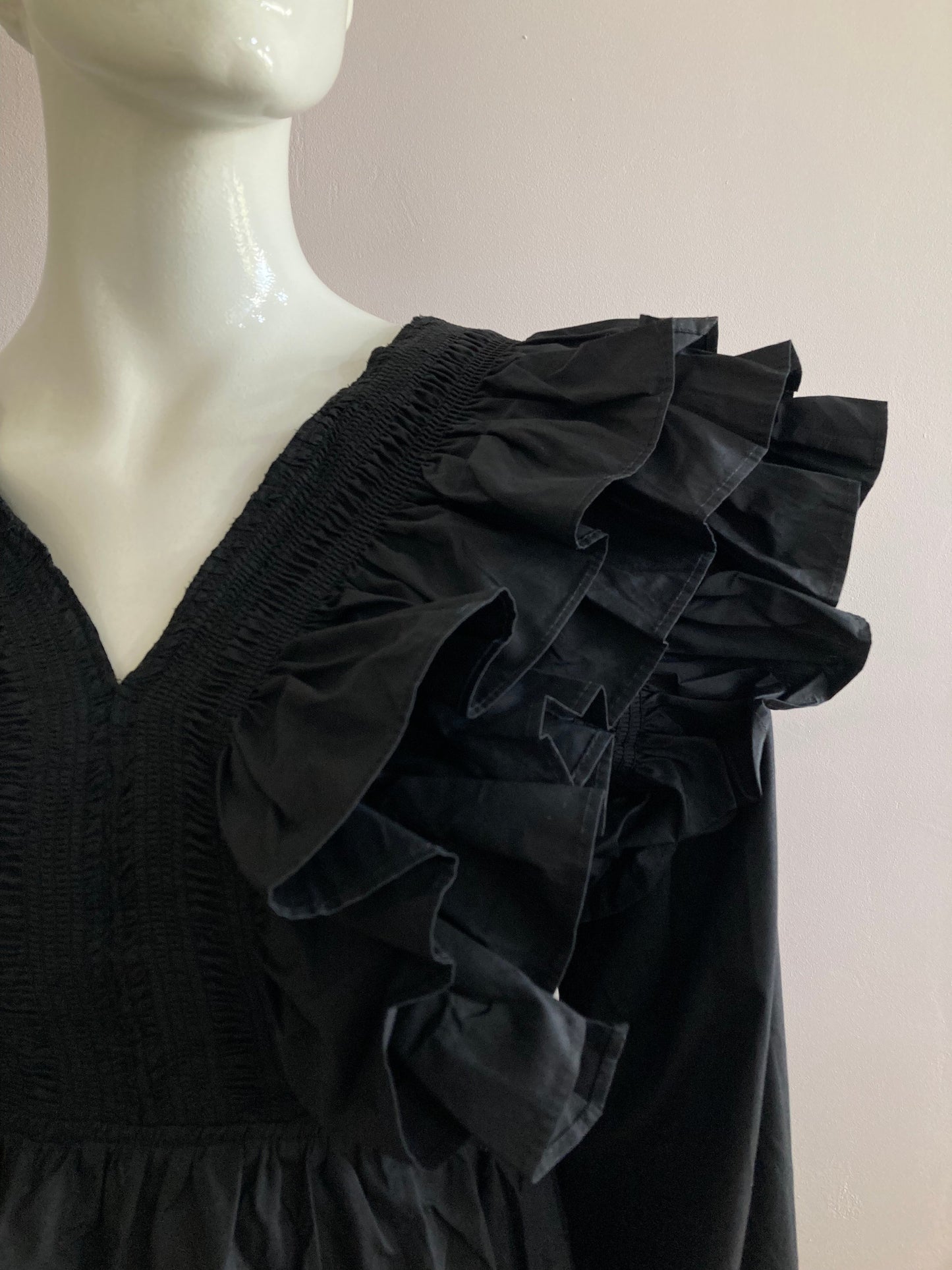 Black frilly blouse