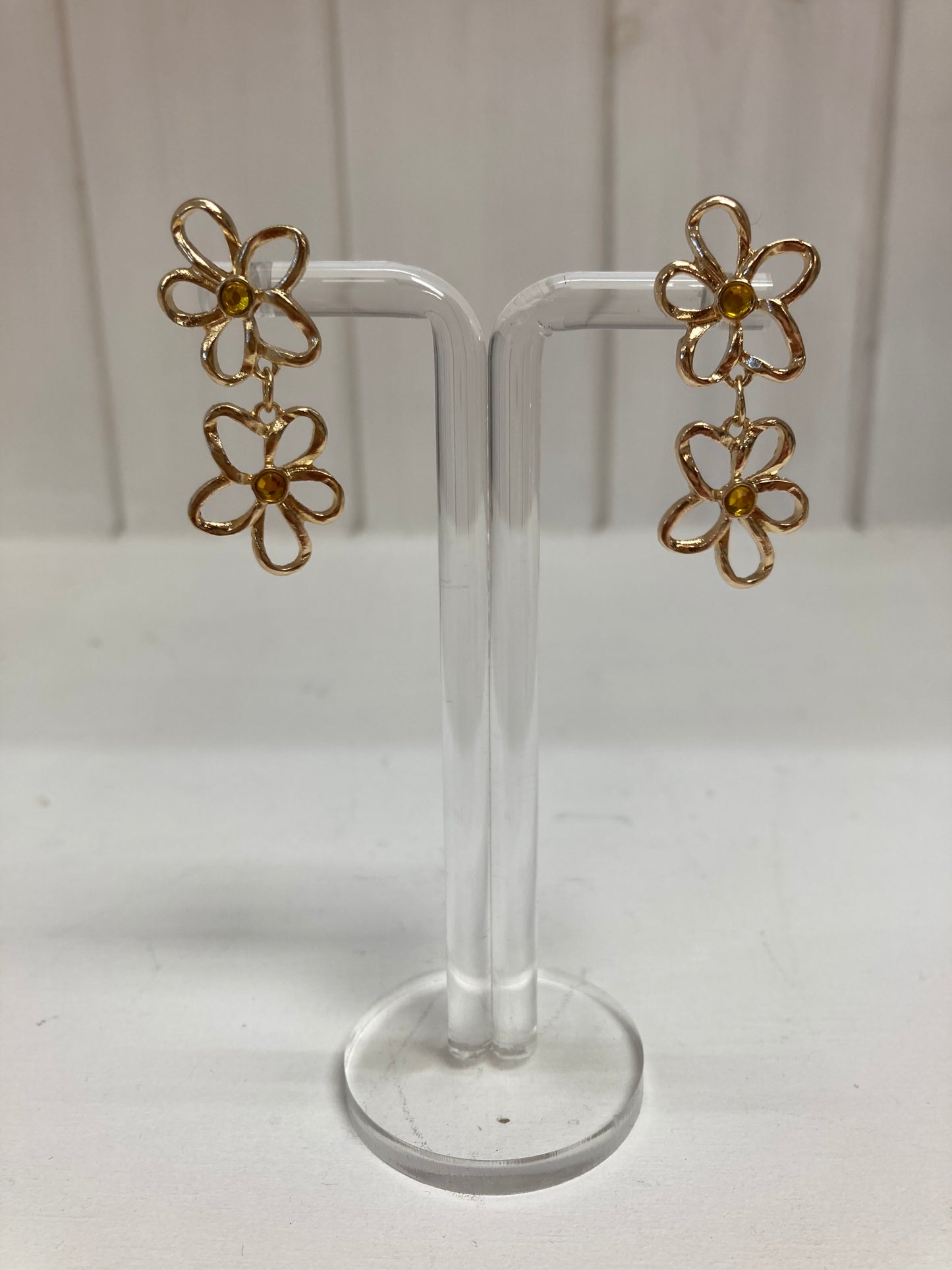 Oorbellen silhouette bloem met steentje goud